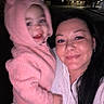 Bella is registered to the contest to win money with this photo: child, woman, hoodie, pink_clothing, smile, night, selfie, outdoor, person, face, dark_background, holding, warm_clothing, happy, portrait, long_hair, casual, cute, baby, cozy