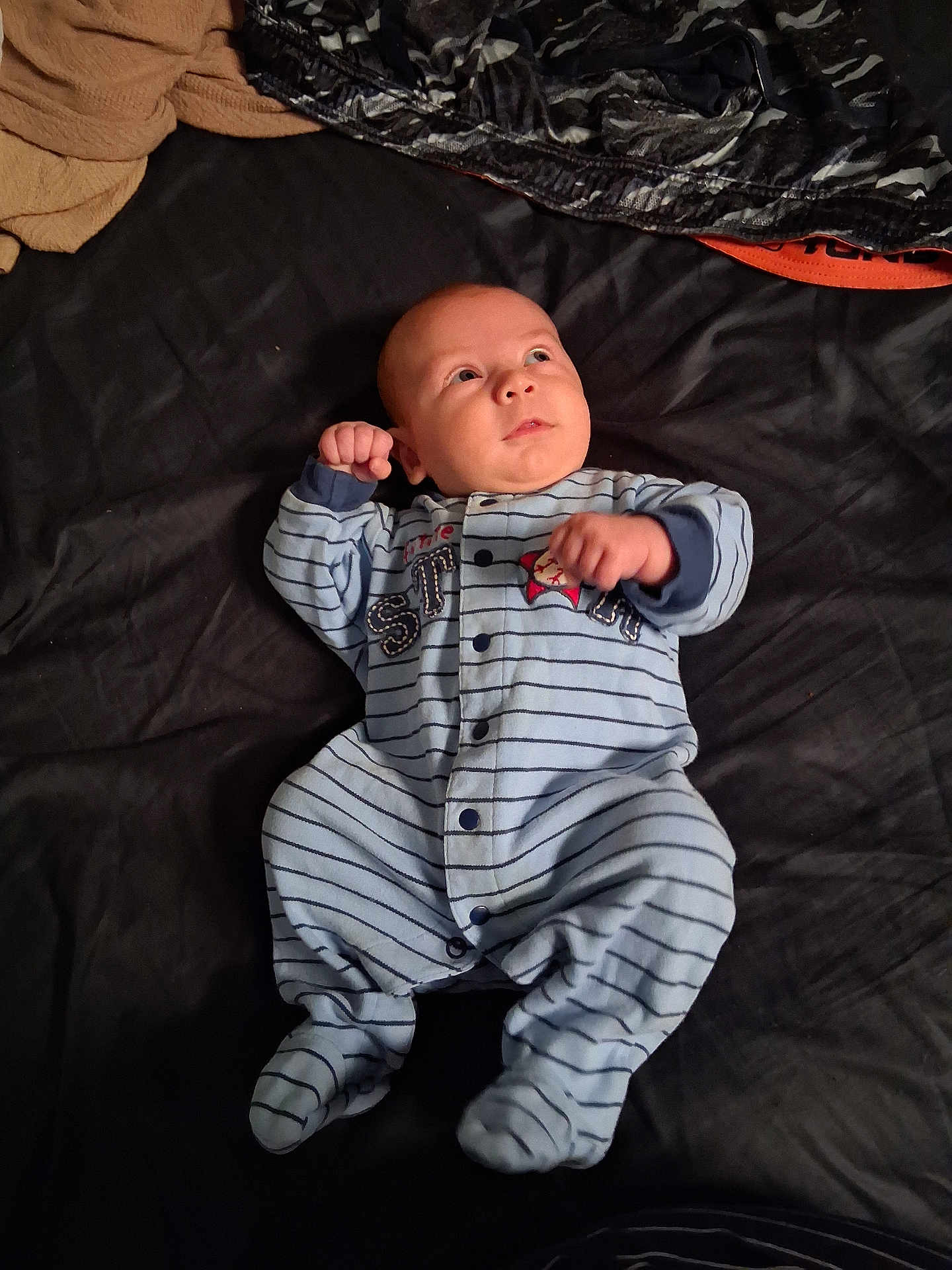 Paul joined the competition — help win amazing prizes! baby, infant, onesie, striped_clothing, bed, blanket, sleepwear, child, person, cute, small_hands, face, looking_up, lying_down, indoors, soft_fabric, cozy, newborn, pajamas, resting