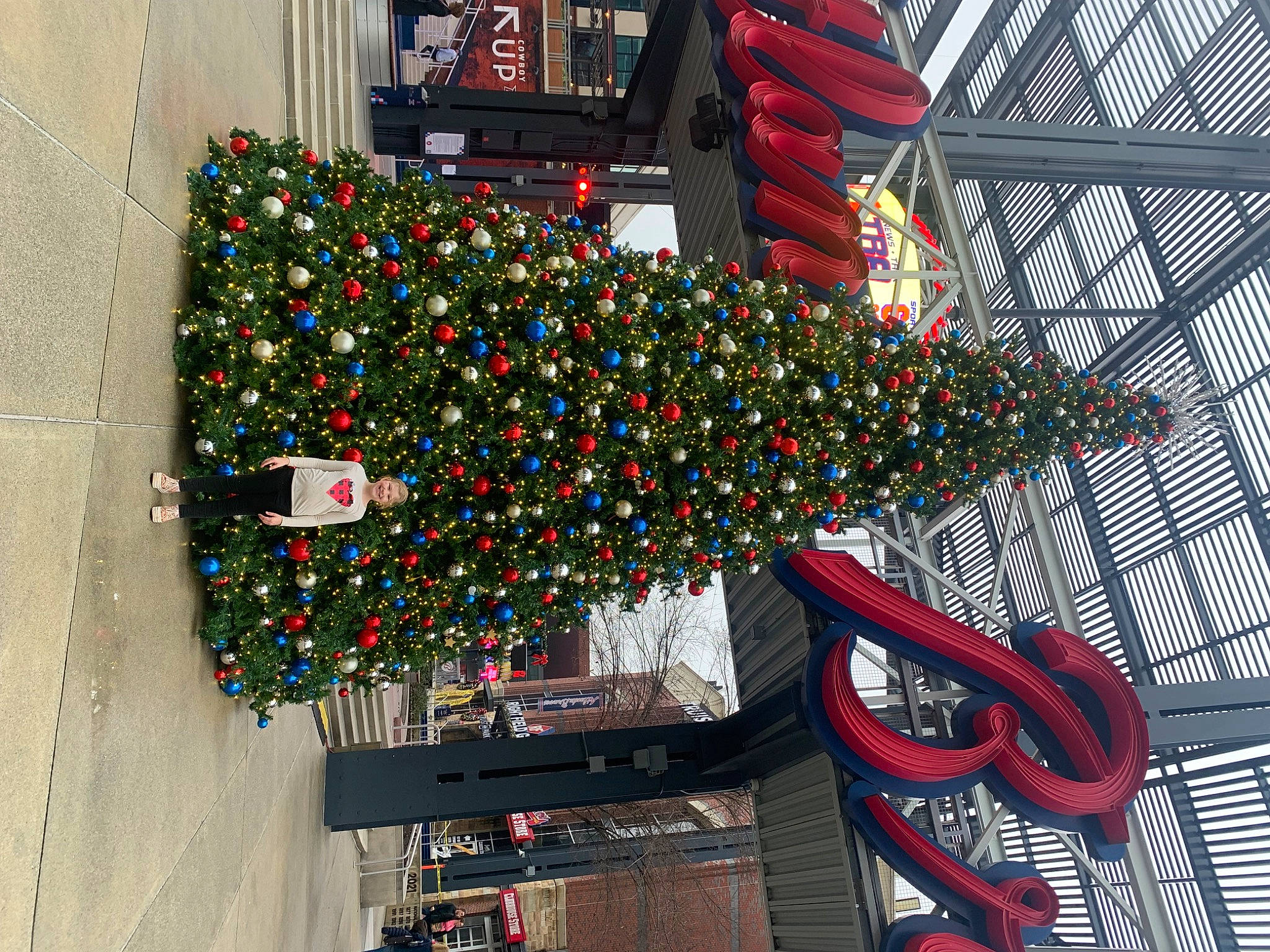 Bayleigh is registered to the contest to win money with this photo: building, christmas, christmas_decoration, christmas_ornament, christmas_tree, city, event, evergreen, facade, holiday, holiday_ornament, house, joy, landmark, ornament, person, plant, tree, urban_area, urban_design