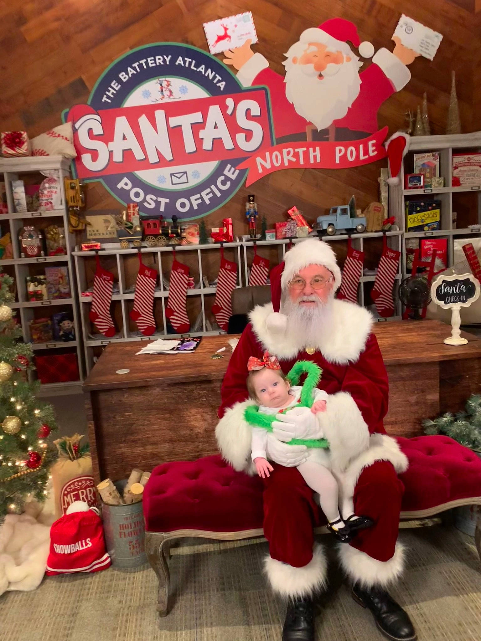 Saylem is registered to the contest to win money with this photo: beard, christmas, christmas_decoration, christmas_eve, christmas_ornament, christmas_tree, event, fur, hat, headwear, holiday, holiday_ornament, lap, ornament, person, plant, red, retail, santa_claus, shelf