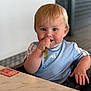 Zane joined the competition — help win amazing prizes! toddler, child, baby, blue_eyes, high_chair, green_bean, eating, table, marble_table, indoor, casual_clothing, short_hair, person, cute, curious, seated, food, hand, face, portrait