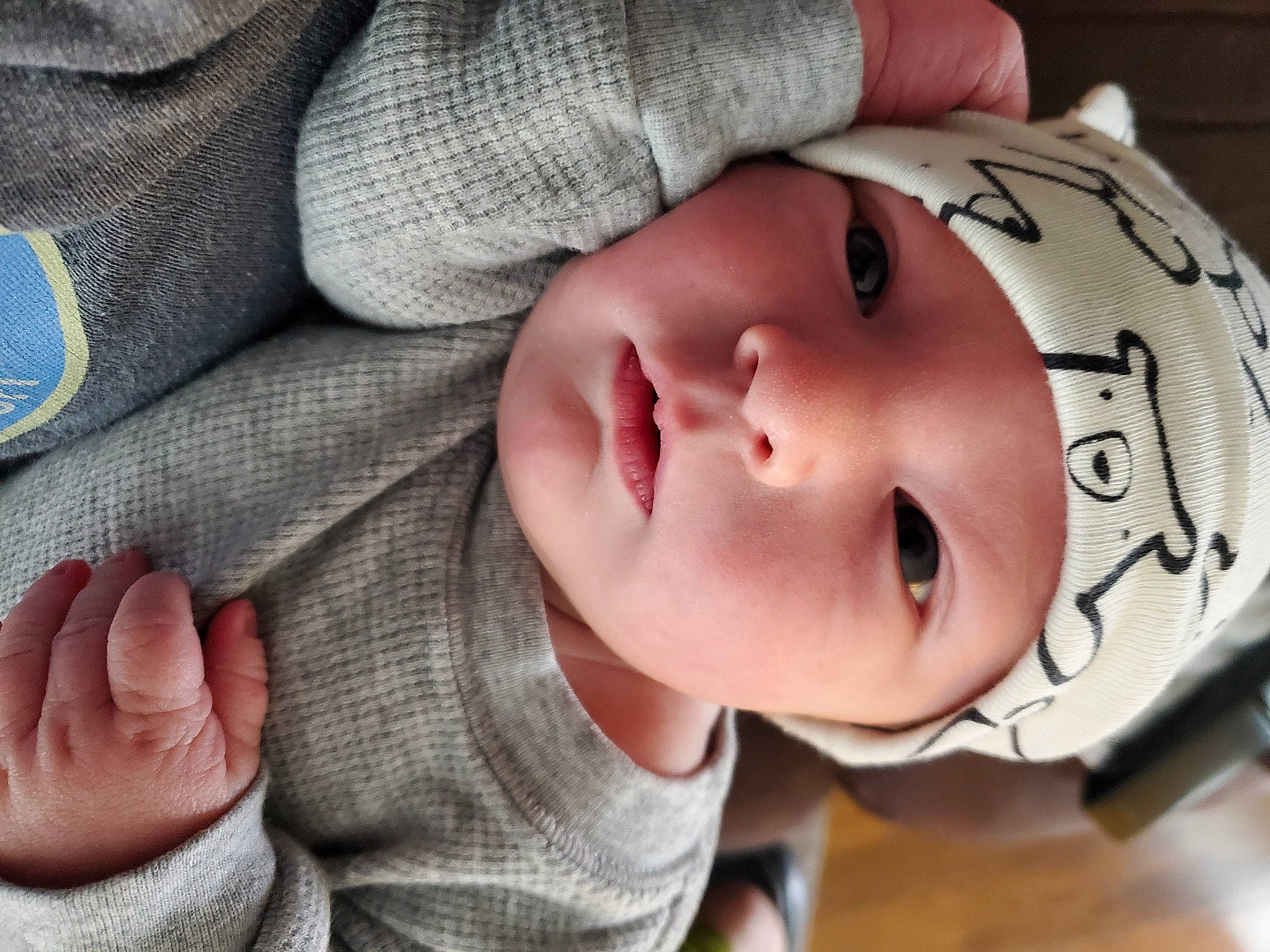 Finley is registered to the contest to win money with this photo: baby, baby_toddler_clothing, cheek, child, comfort, eye, eyebrow, eyelash, face, finger, head, headwear, human_body, lip, mouth, nail, nose, person, skin, sleeve
