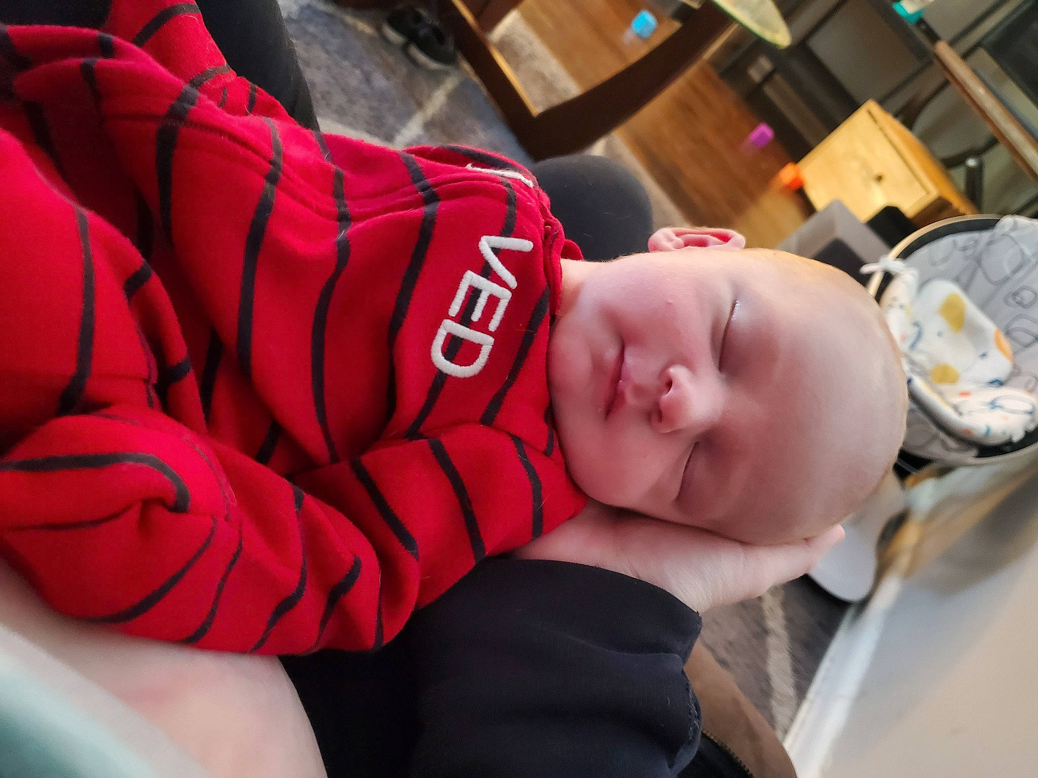 Finley is registered to the contest to win money with this photo: audio_equipment, baby, baby_products, baby_toddler_clothing, car_seat, carmine, chair, child, comfort, fun, hat, human_leg, knee, nap, person, personal_protective_equipment, room, sitting, sleep, thigh