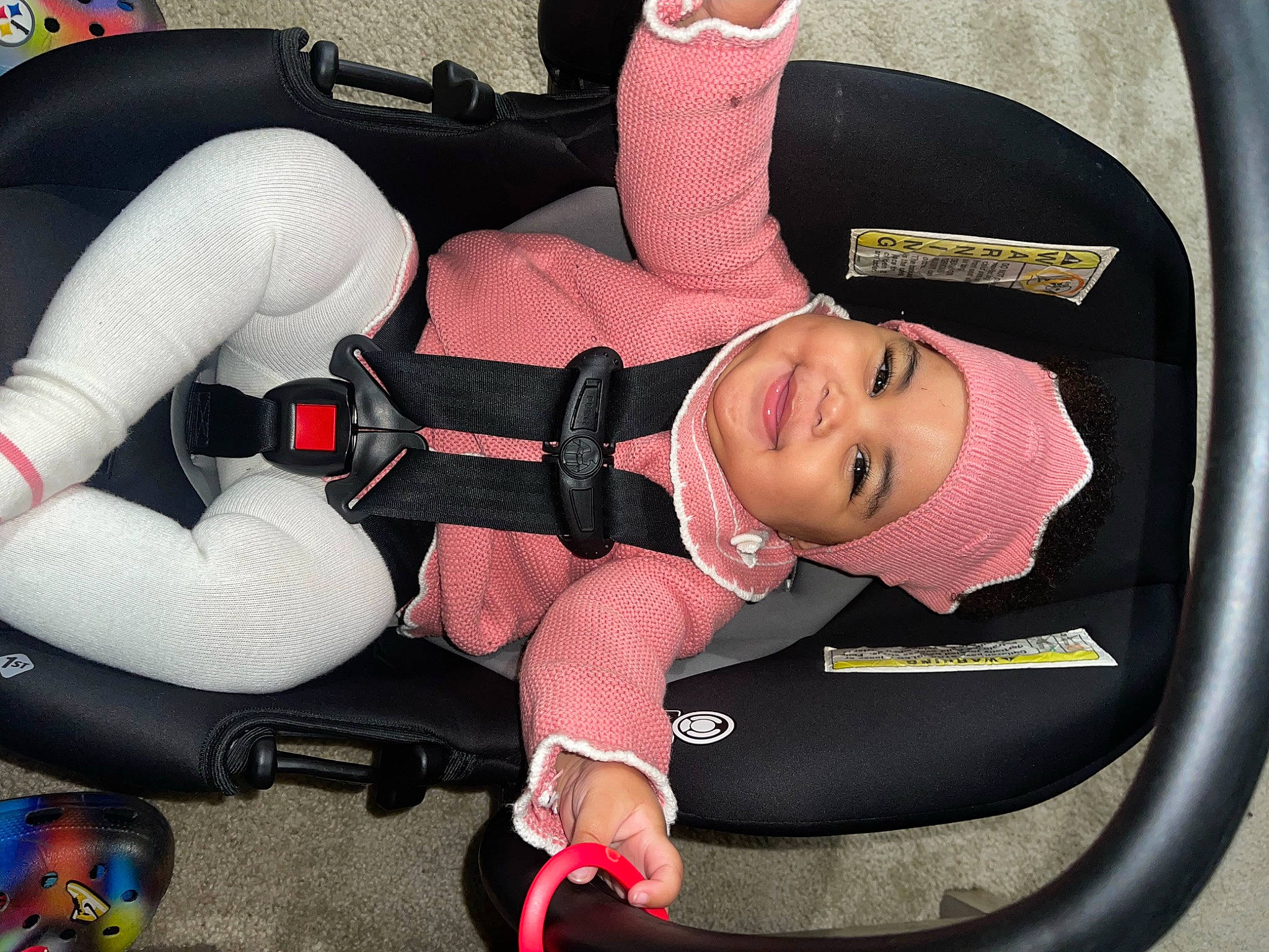 Nariah is registered to the contest to win money with this photo: auto_part, automotive_design, automotive_exterior, automotive_wheel_system, baby_carriage, car_seat, comfort, finger, headwear, joy, knee, lap, leg, motor_vehicle, person, product, smile, snapshot, steering_wheel, thigh