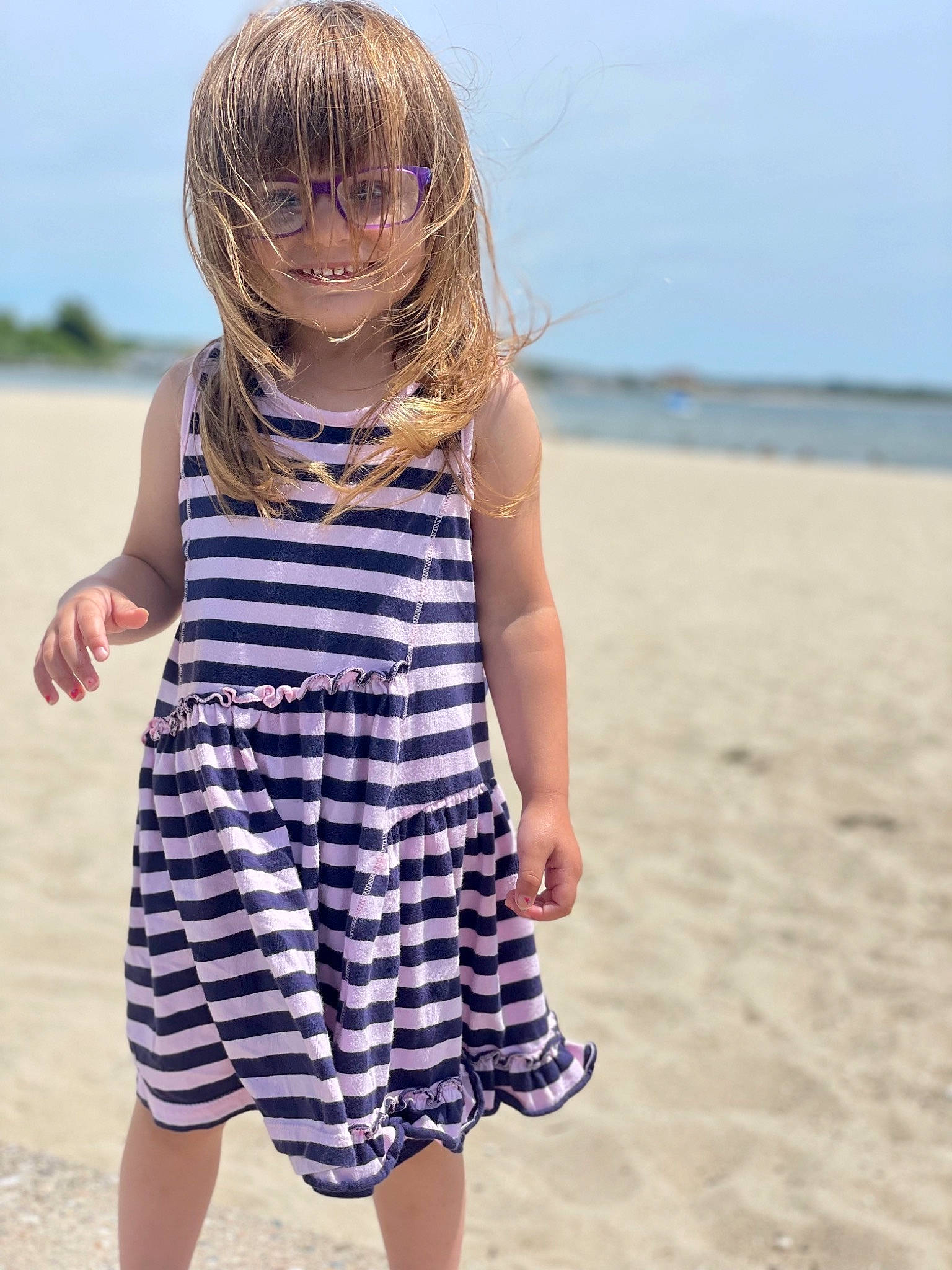 Sage is registered to the contest to win money with this photo: azure, beach, day_dress, fun, gesture, hair, hairstyle, happy, joint, joy, natural_environment, one_piece_garment, people_in_nature, people_on_beach, person, shore, sky, sleeve, smile, street_fashion