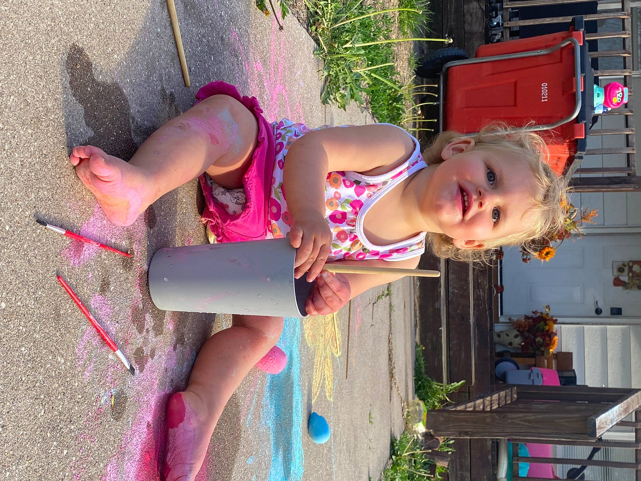 Megara is registered to the contest to win money with this photo: calf, child, eyewear, foot, fun, green, happy, human_leg, knee, leisure, magenta, person, pink, plant, recreation, sandal, smile, thigh, toddler, trunk