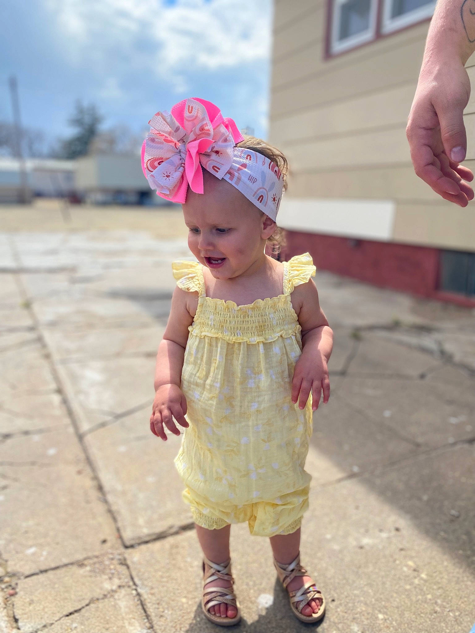 Megara is registered to the contest to win money with this photo: baby, baby_toddler_clothing, cap, cloud, event, eye, face, fashion_accessory, fun, grass, happy, hat, head, headwear, leisure, magenta, person, pink, plant, sky