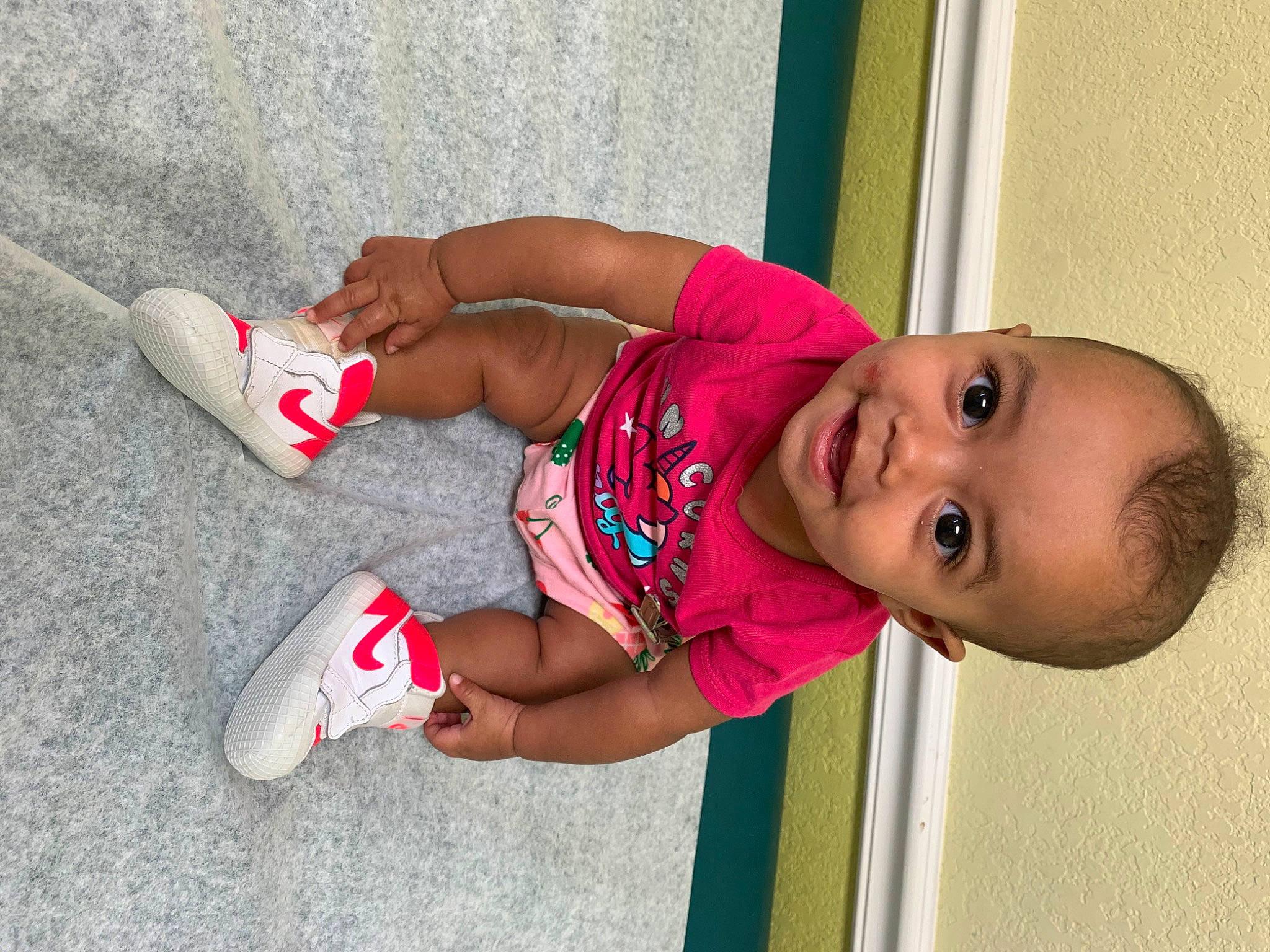 Faythe is registered to the contest to win money with this photo: baby, baby_toddler_clothing, child, dress, elbow, finger, foot, fun, happy, human_body, human_leg, joint, knee, leg, leisure, person, pink, smile, thigh, toddler