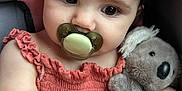 Brynleigh joined the competition — help win amazing prizes! adorable, baby, car_seat, child, closeup, curly_hair, cute, dress, hand, infant, koala, pacifier, pink, plush_toy, portrait, sitting, skin, soft_toy, stuffed_animal, young