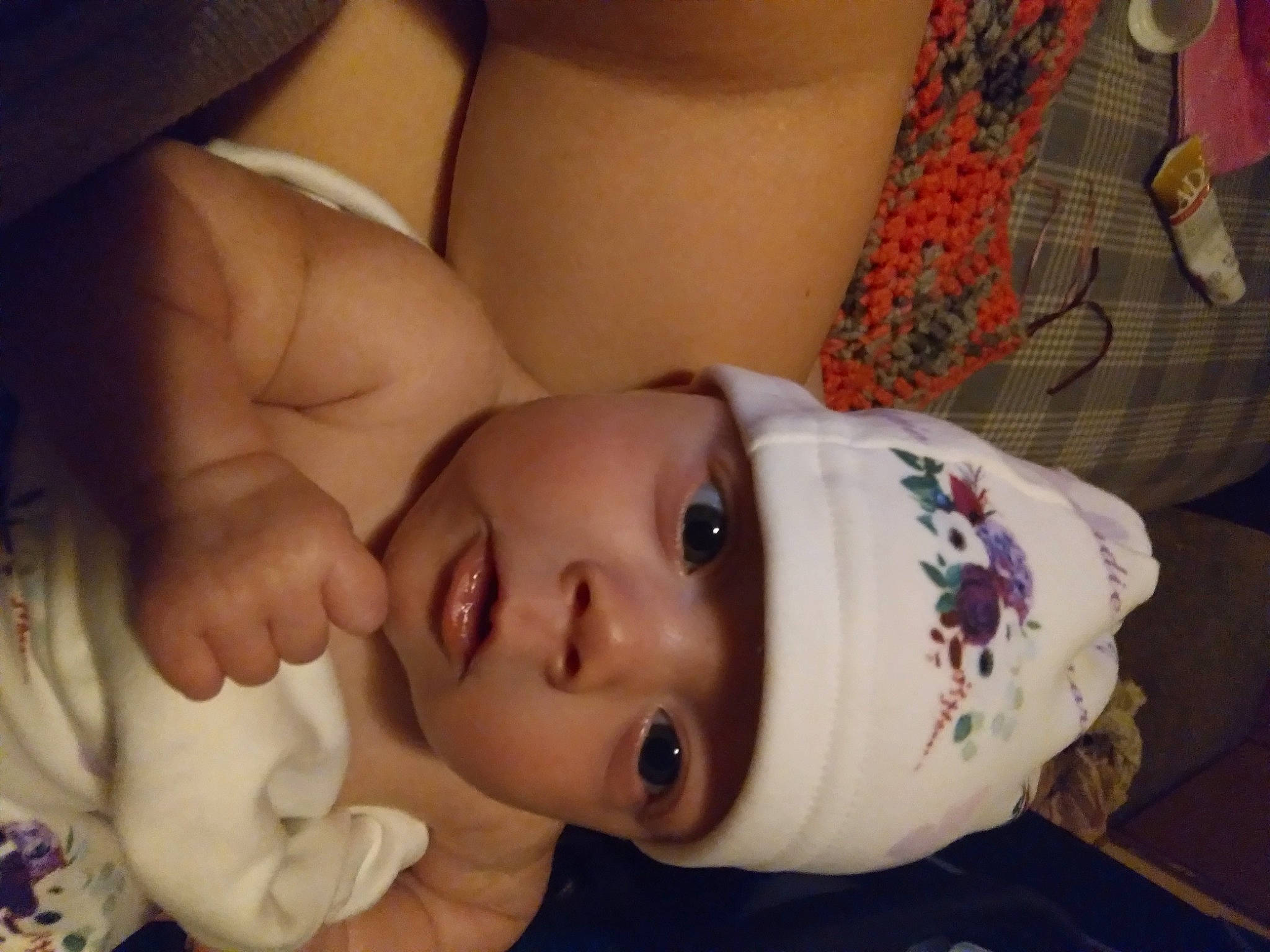 Sadie is registered to the contest to win money with this photo: abdomen, baby, baby_toddler_clothing, cheek, chest, comfort, eye, eyebrow, eyelash, gesture, headwear, iris, lip, mouth, nose, organ, person, skin, sleeve, textile