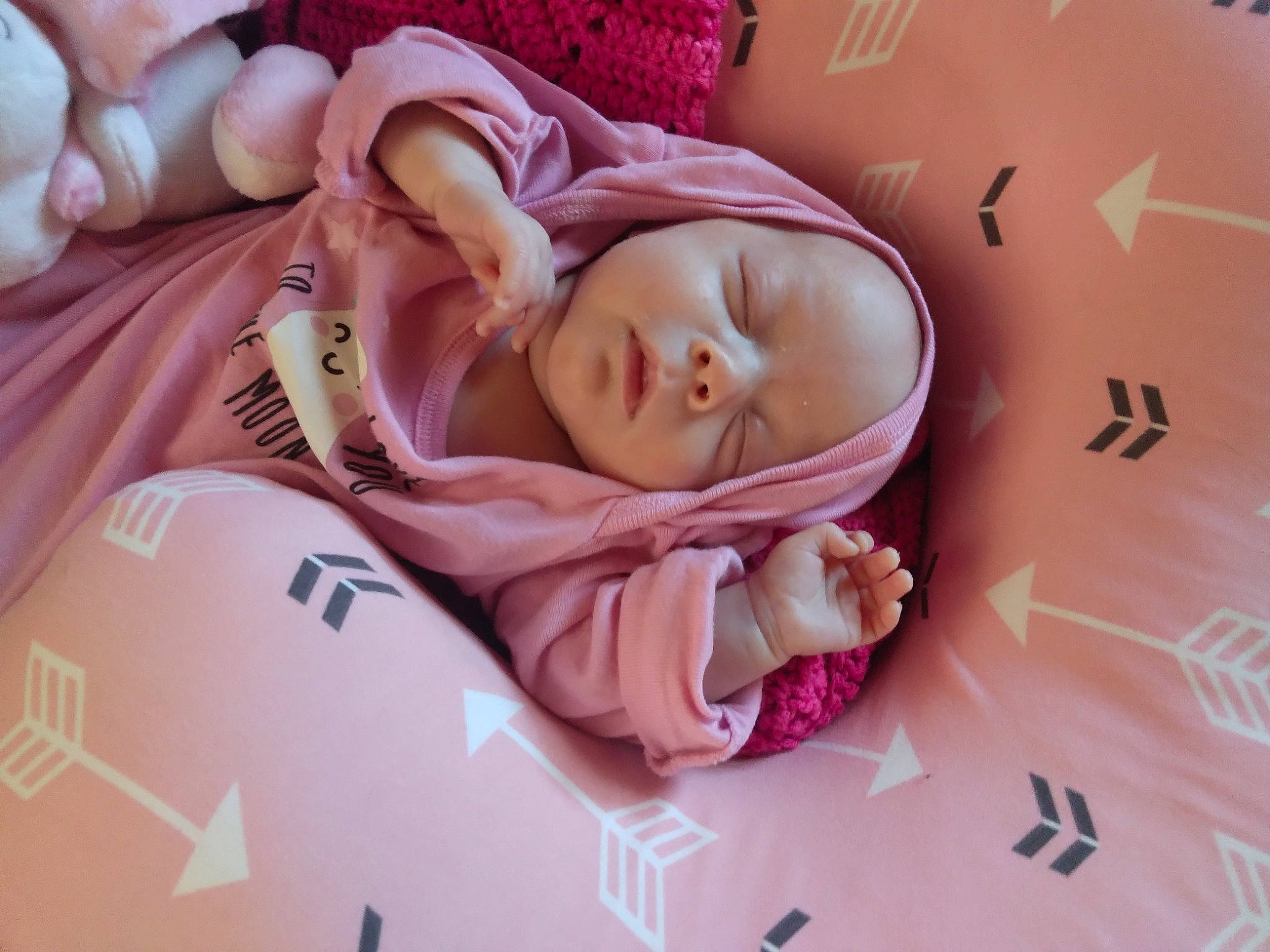 Katie is registered to the contest to win money with this photo: baby, baby_products, baby_sleeping, baby_toddler_clothing, bedding, bedtime, cheek, child, comfort, eyelash, head, headwear, linens, magenta, nap, pattern, person, pink, room, skin