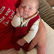 Josephine joined the competition — help win amazing prizes! baby, newborn, sleeping, infant, person, adult, hand, clothing, red_shirt, white_shirt, soft_fabric, cozy, resting, portrait, indoor, couch, comfort, peaceful, cute, toddler