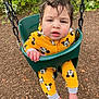 Royal joined the competition — help win amazing prizes! child, toddler, swing, playground, yellow_clothing, mickey_mouse, onesie, barefoot, green_swing, outdoor, mulch, hand, face, hair, expression, nature, park, cute, casual, daylight