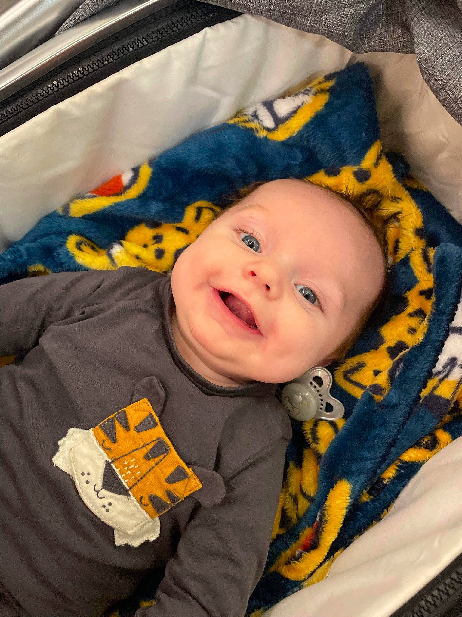 Coby is registered to the contest to win money with this photo: baby, baby_laughing, baby_products, baby_safety, baby_toddler_clothing, car_seat, cheek, child, comfort, facial_expression, fun, happy, iris, laugh, linens, person, room, sleeve, smile, toddler