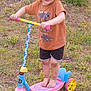 John joined the competition — help win amazing prizes! barefoot, blue, child, dirt, fun, grass, greenery, kids, nature, outdoor, person, pink, play, scooter, shorts, smile, summer, toy, tshirt, yellow