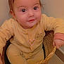 Marie Carmen participe au concours pour gagner de l'argent avec cette photo : baby, basket, child, cozy, curious, cute, face, floor, hand, head, indoor, infant, onesie, person, portrait, sitting, smiling, woven_basket, yellow_clothing, young_child