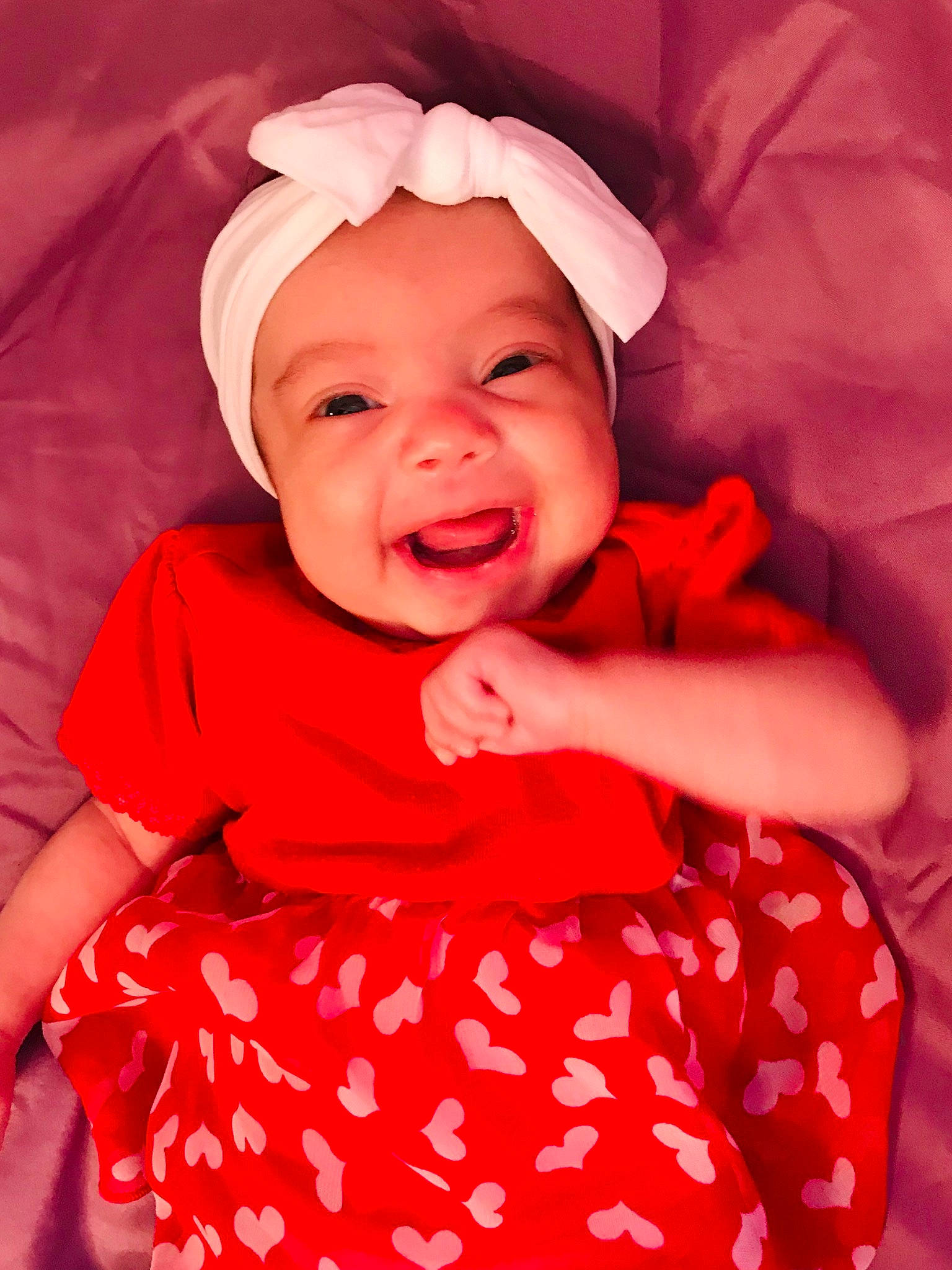 Zari is registered to the contest to win money with this photo: baby, baby_toddler_clothing, cheek, child, child_model, facial_expression, happy, head, headwear, joy, lip, person, pink, red, skin, smile, toddler