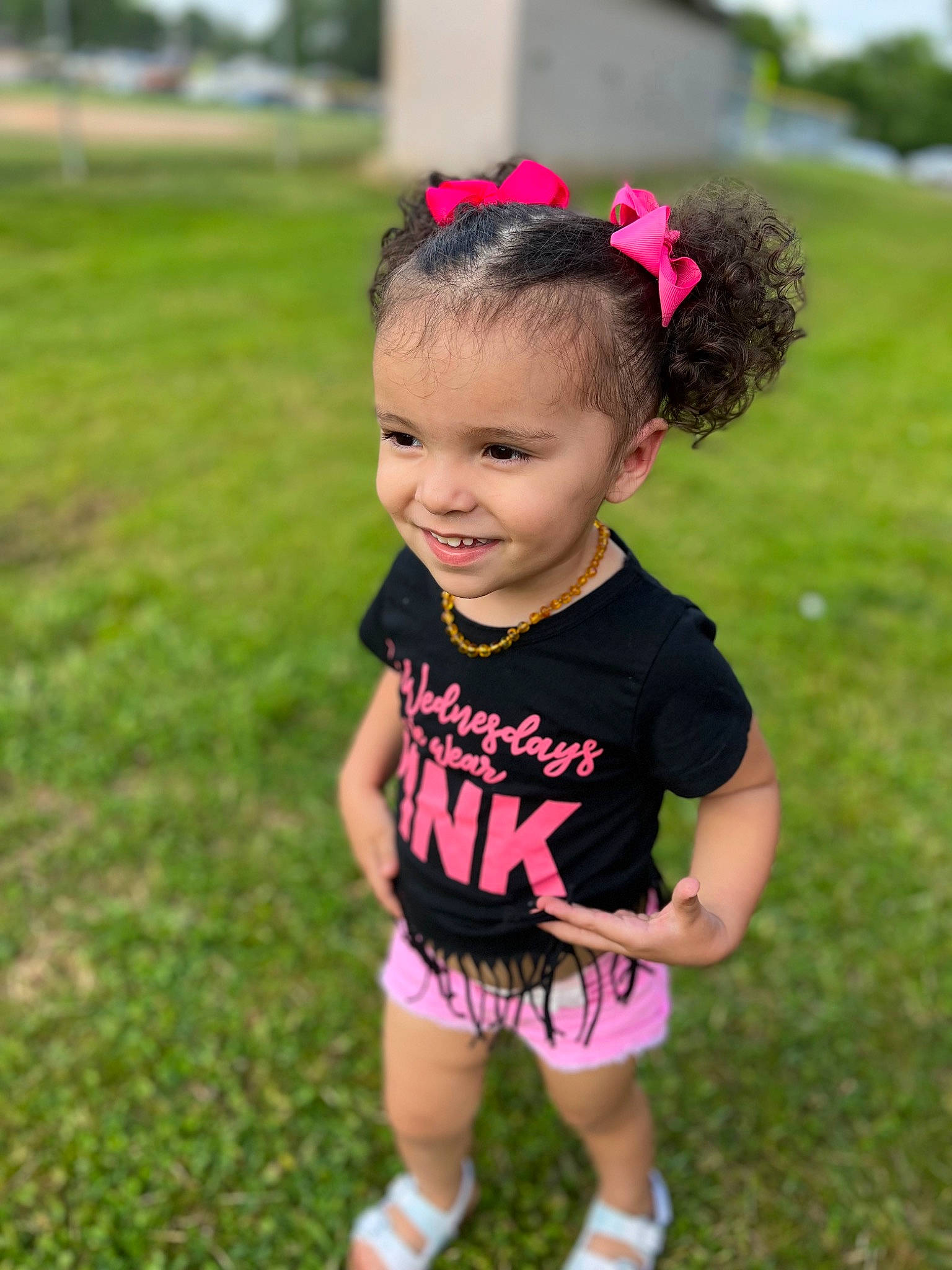 Waverly joined the competition — help win amazing prizes! baby_toddler_clothing, blond, clothing, eye, face, fun, grass, grassland, hair, happy, human_body, joy, meadow, people_in_nature, person, pink, plant, shorts, smile, summer