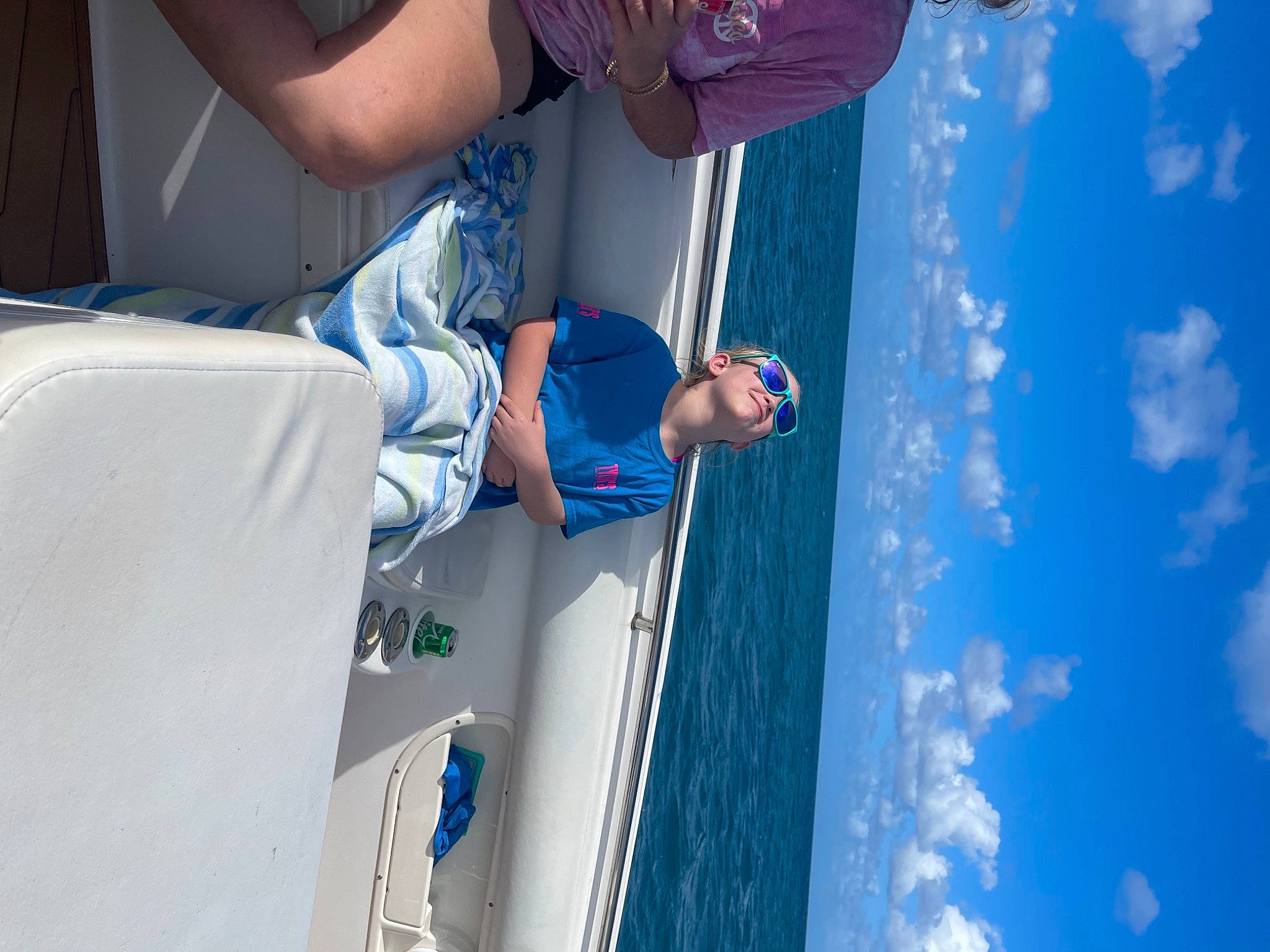 Bailee is registered to the contest to win money with this photo: aqua, azure, blue, boat, boating, headwear, joy, naval_architecture, ocean, person, sea, ship, vacation, water_transportation, watercraft, wind