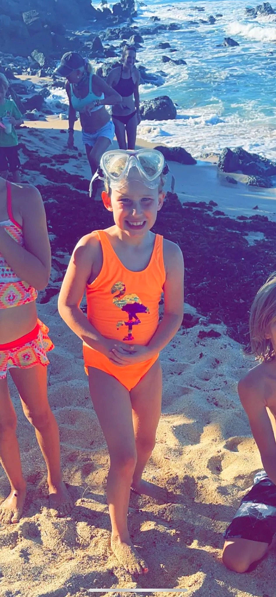 Bailee is registered to the contest to win money with this photo: beach, bikini, calf, clothing, foot, fun, headwear, holiday, joy, maillot, mammal, one_piece_swimsuit, person, sand, summer, swimsuit_bottom, swimwear, tankini, thigh, trunk