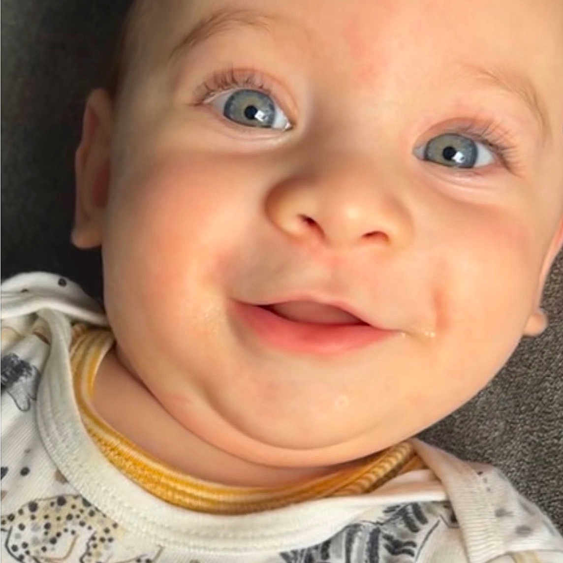 Zaid joined the competition — help win amazing prizes! animal_print, baby, blue_eyes, cheeks, child, close_up, cute, expression, face, happy, infant, leopard, onesie, panda, portrait, skin, smile, soft_lighting, young, zebra