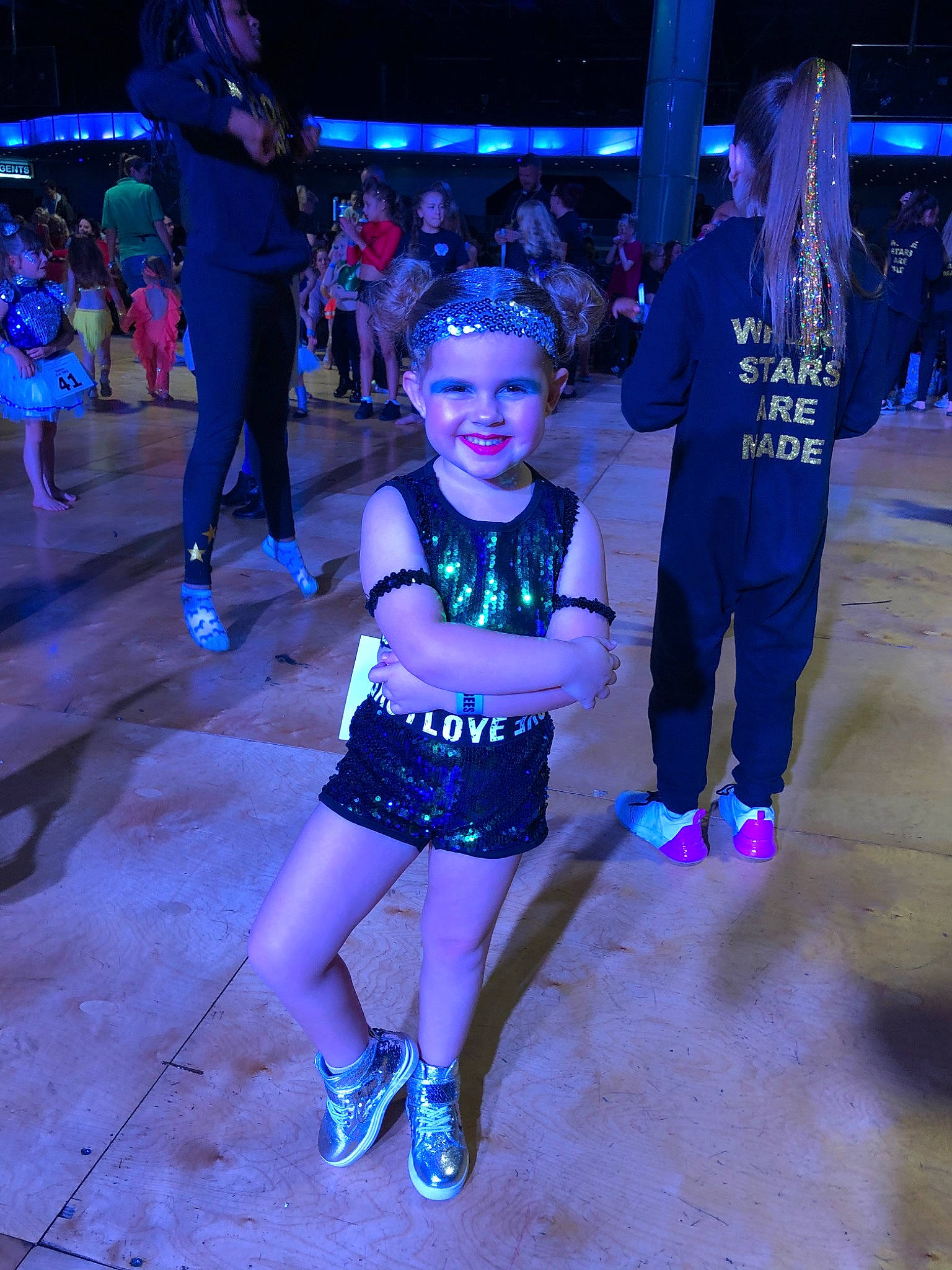 Melodie is registered to the contest to win money with this photo: costume, crowd, dance, dancer, disco, electric_blue, event, fashion, fun, joy, leisure, music, night, party, performance, performing_arts, person, recreation, vacation