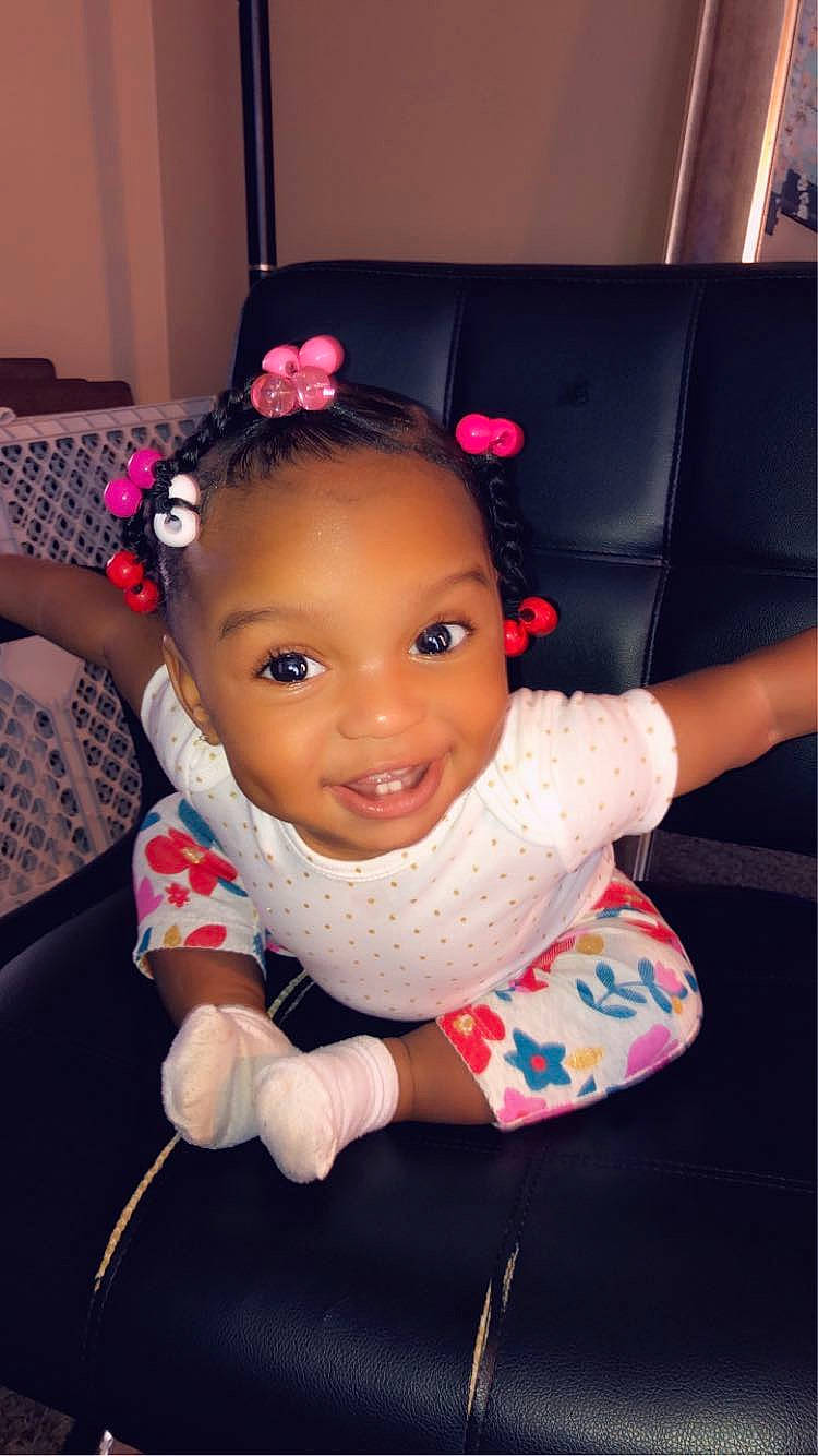 Leiah is registered to the contest to win money with this photo: arm, baby, beauty, cheek, child, cool, ear, eye, face, forehead, fun, hair, hair_accessory, hairstyle, head, headgear, joy, lip, person, pink