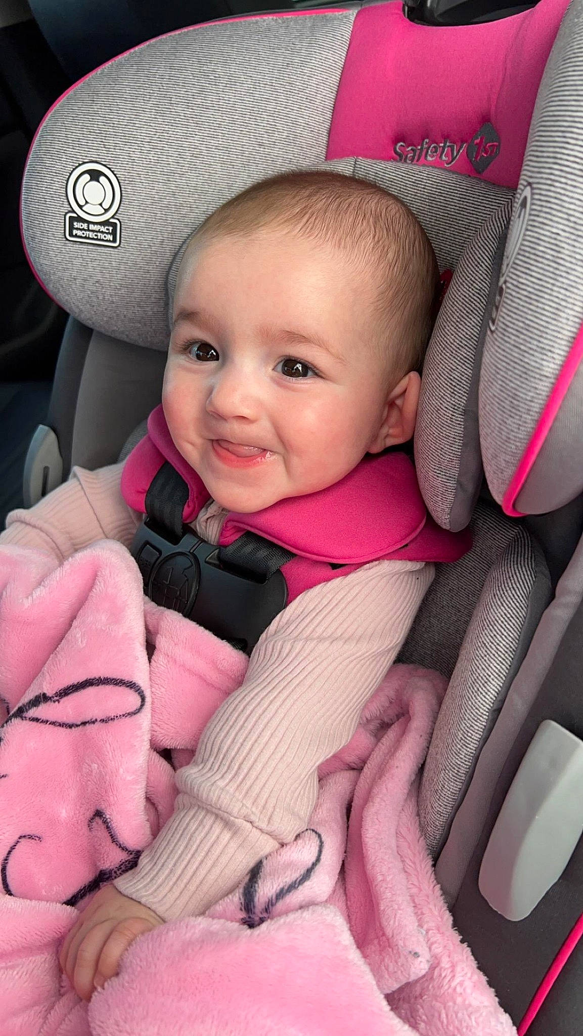 Evaleigh is registered to the contest to win money with this photo: baby, baby_carriage, baby_in_car_seat, baby_safety, baby_toddler_clothing, cheek, comfort, eyebrow, facial_expression, finger, joy, organ, person, photograph, pink, product, skin, smile, textile, thumb