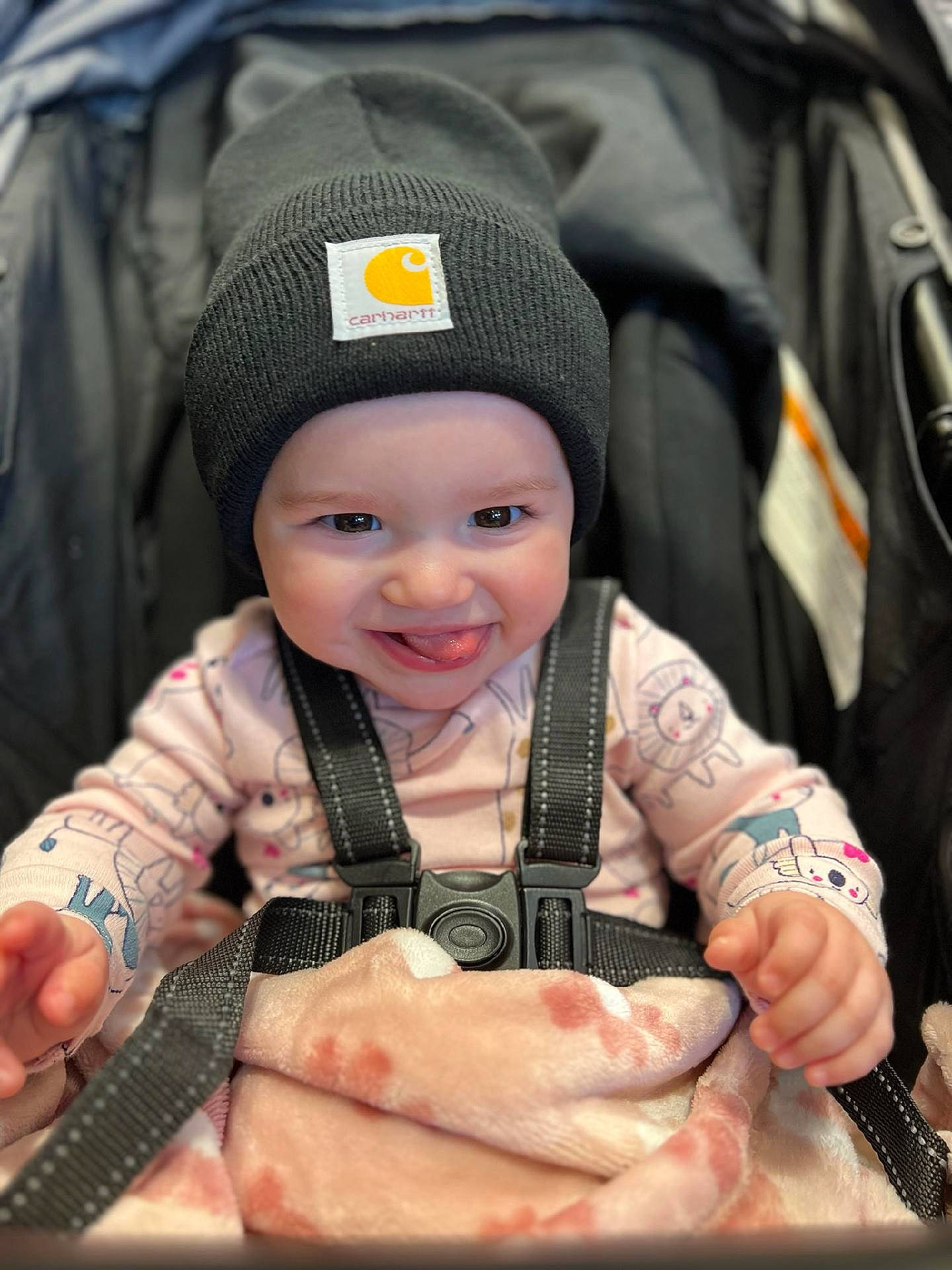 Evaleigh joined the competition — help win amazing prizes! baby, baby_carriage, baby_products, baby_toddler_clothing, baseball_cap, cap, child, comfort, facial_expression, finger, gesture, hand, happy, headwear, joy, nail, person, product, sitting, sleeve