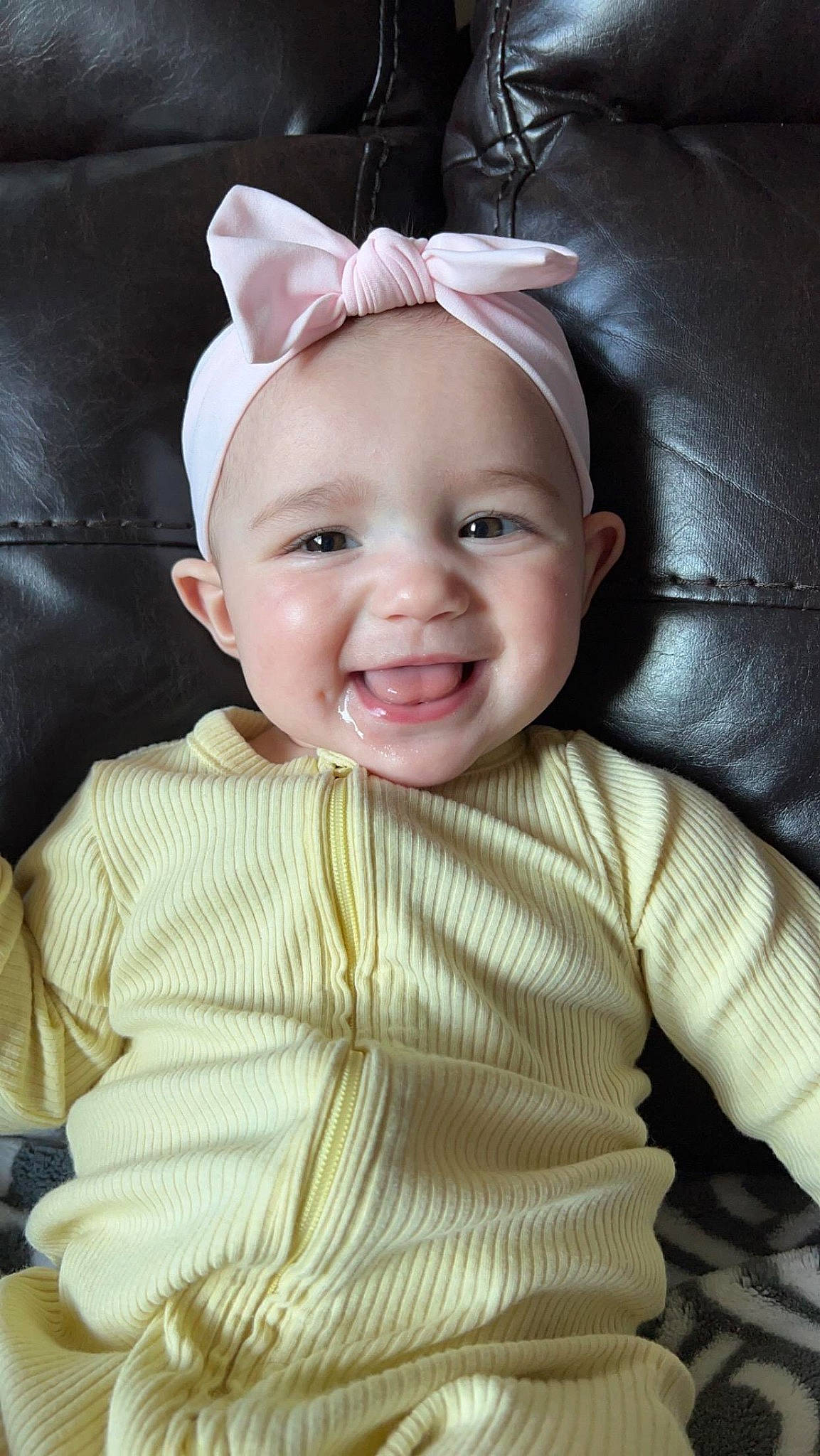 Evaleigh is registered to the contest to win money with this photo: baby, baby_laughing, baby_toddler_clothing, cheek, comfort, eye, face, fashion_accessory, flash_photography, happy, headpiece, human_body, iris, joy, laugh, lip, nose, outerwear, person, sleeve