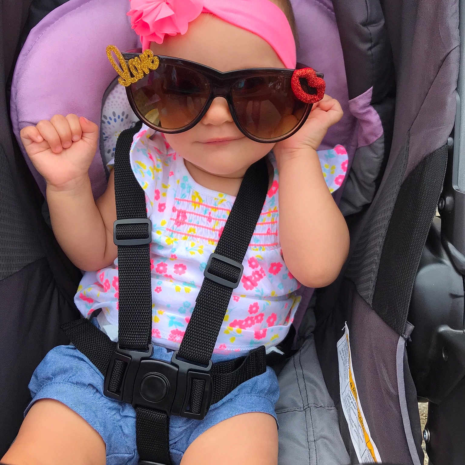 Emorie is registered to the contest to win money with this photo: auto_part, baby_carriage, car_seat, child, cool, eyewear, fashion_accessory, glasses, goggles, headgear, personal_protective_equipment, pink, plant, seat_belt, sunglasses, vacation, vision_care