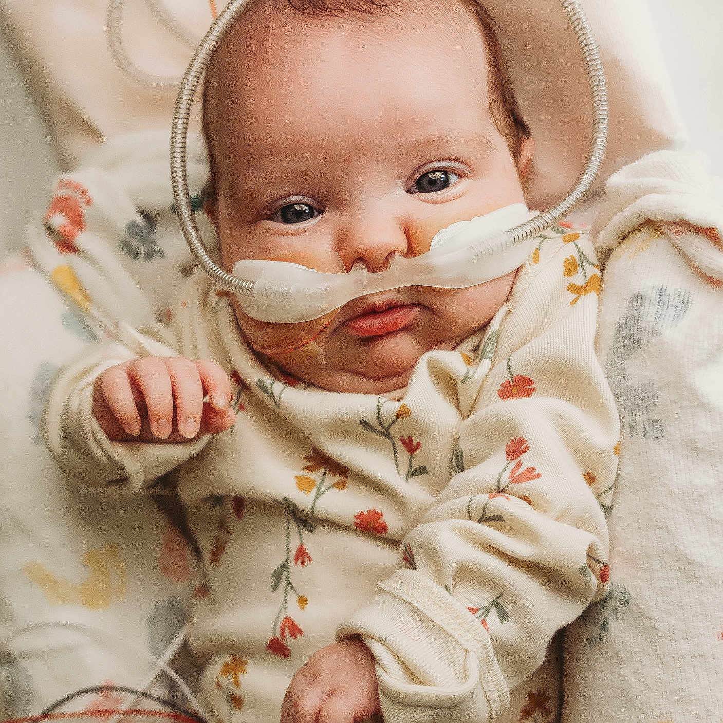Angel is registered to the contest to win money with this photo: architecture, baby, babylaughing, bodypart, bonnet, building, clothing, face, finger, frown, hand, happy, hat, head, hospital, newborn, person, photography, portrait, smile