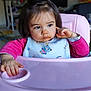 toddler, child, high_chair, bib, pink, indoor, face, expression, food, hand, hair, clothing, person, young_child, table, seat, cute, portrait, baby, skin