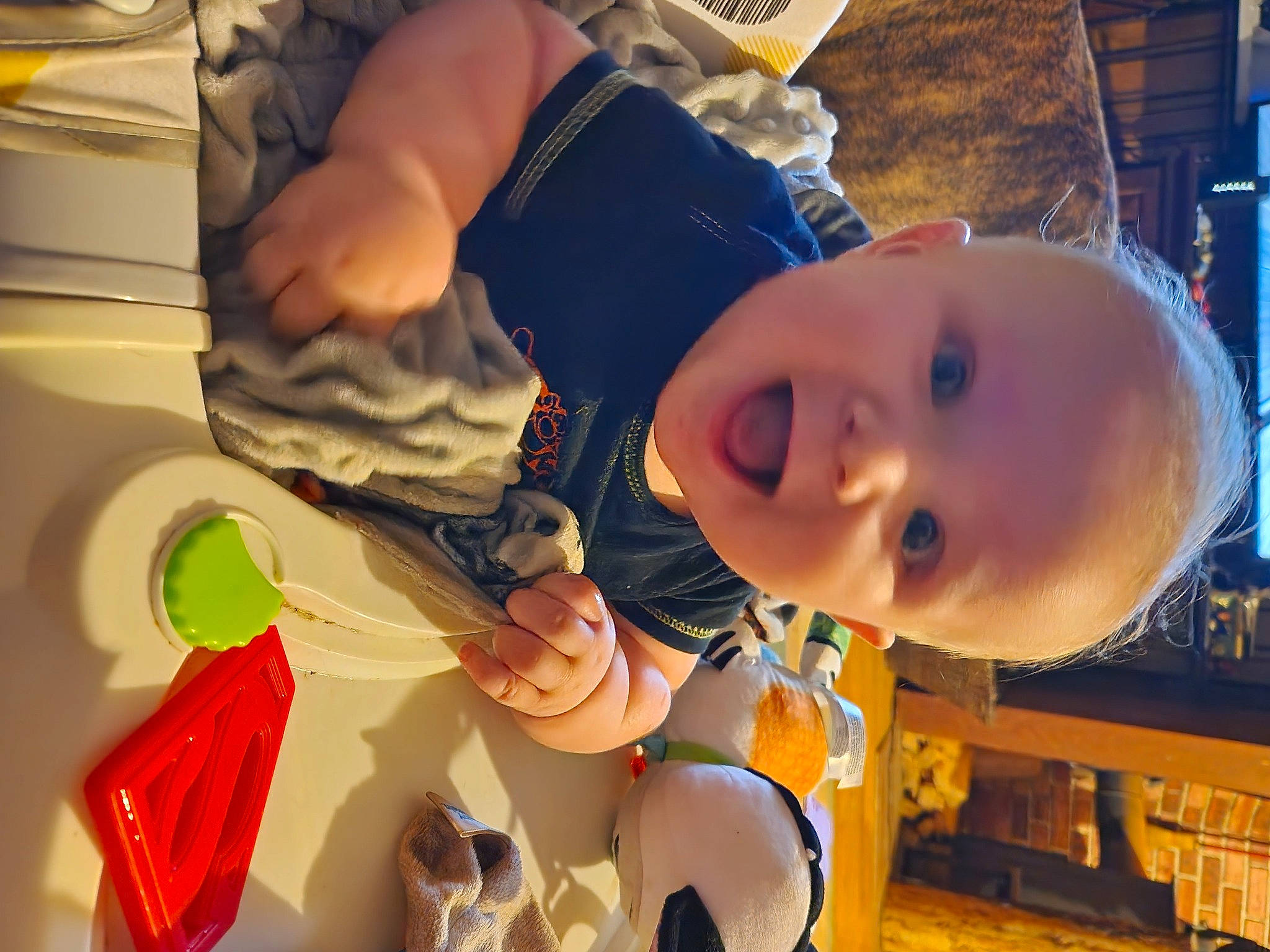 Kalel is registered to the contest to win money with this photo: baby, baby_products, baby_toddler_clothing, cheek, child, event, finger, fun, hand, happy, leisure, mouth, orange, party, party_supply, person, play, room, smile, toddler