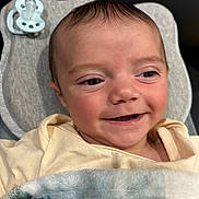 Ryder joined the competition — help win amazing prizes! baby, smiling, face, blanket, pacifier, cushion, infant, closeup, cute, happy, child, clothing, indoor, newborn, portrait, young, babywear, resting, comfort, soft
