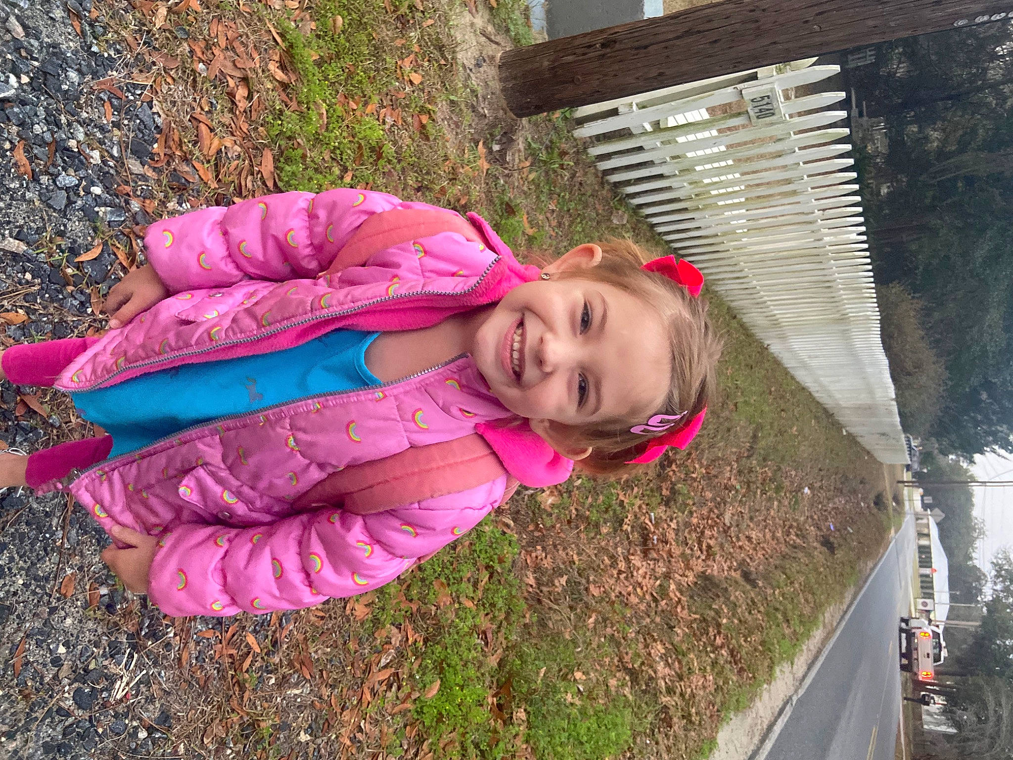 Aubry is registered to the contest to win money with this photo: asphalt, child, fun, grass, happy, joy, landscape, leisure, magenta, people_in_nature, person, pink, plant, portrait_photography, recreation, road_surface, smile, toddler, tree, winter