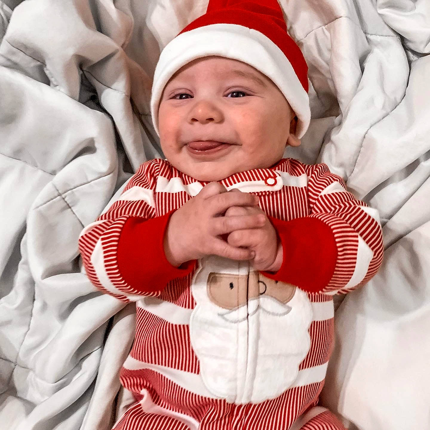 Fabian joined the competition — help win amazing prizes! baby, baby_toddler_clothing, cap, child, collar, comfort, event, finger, gesture, happy, headwear, joy, outerwear, pattern, person, red, santa_claus, sleeve, smile, textile
