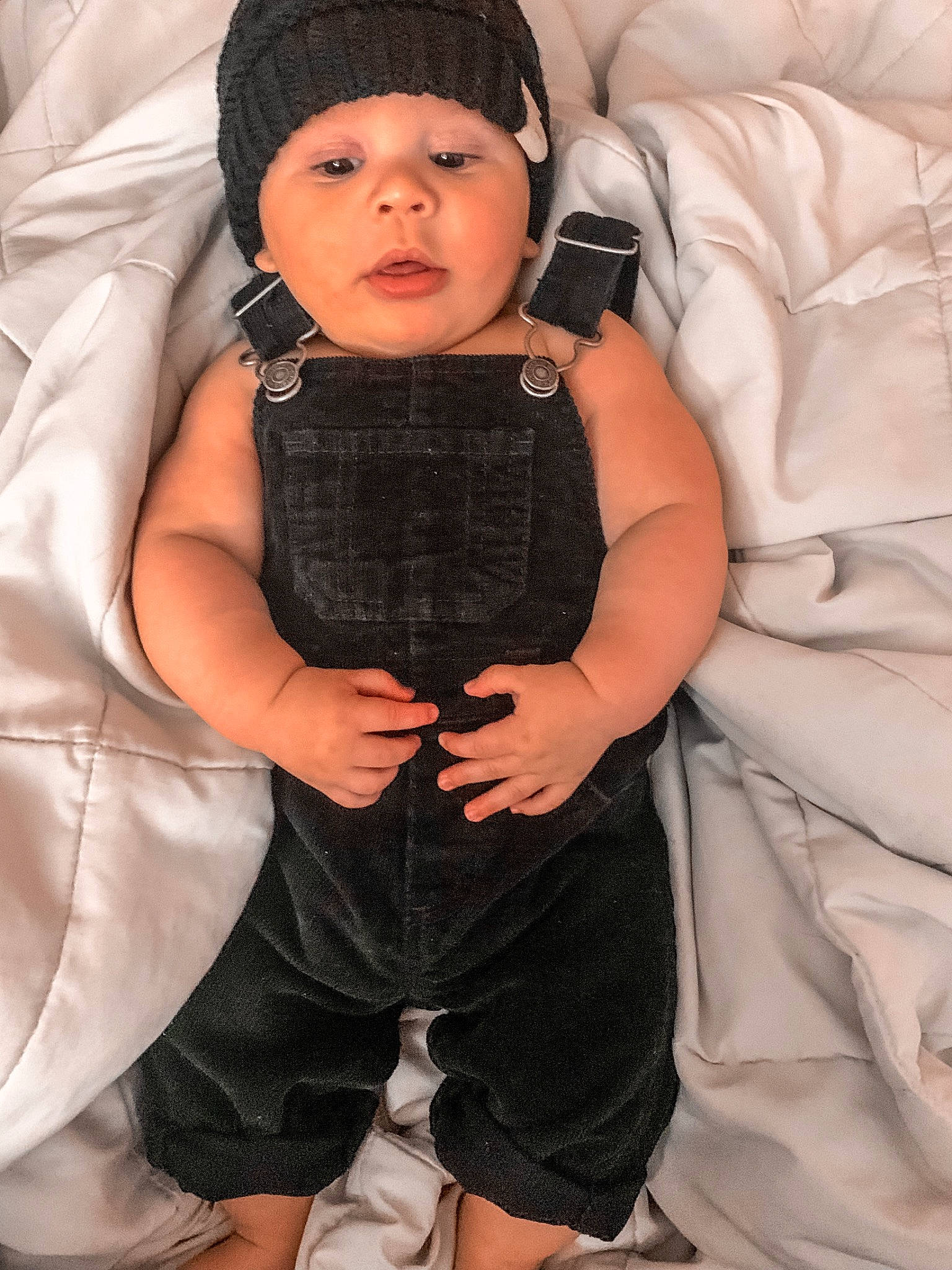 Fabian joined the competition — help win amazing prizes! baby, baby_toddler_clothing, cap, child, comfort, fashion_accessory, finger, flash_photography, gadget, gesture, headwear, knit_cap, outerwear, pattern, person, personal_protective_equipment, pink, sitting, skin, sleeve