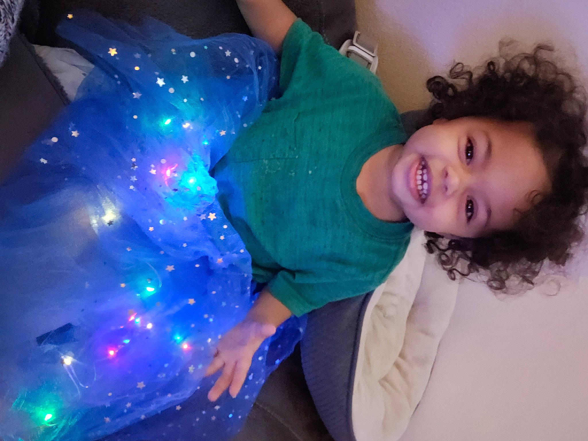 Aniyah is registered to the contest to win money with this photo: azure, blue, child, christmas, christmas_decoration, cool, electric_blue, event, flash_photography, fun, happy, holiday, joy, leisure, magenta, person, portrait_photography, purple, smile, standing