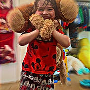 Grayson is registered to the contest to win money with this photo: blurry_background, child, childrens_room, clothing, cute, floor, fun, happy, indoor, joy, mickey_mouse, person, playful, portrait, red_shirt, shorts, smiling, stuffed_animal, toy, young