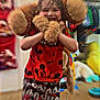 blurry_background, child, childrens_room, clothing, cute, floor, fun, happy, indoor, joy, mickey_mouse, person, playful, portrait, red_shirt, shorts, smiling, stuffed_animal, toy, young