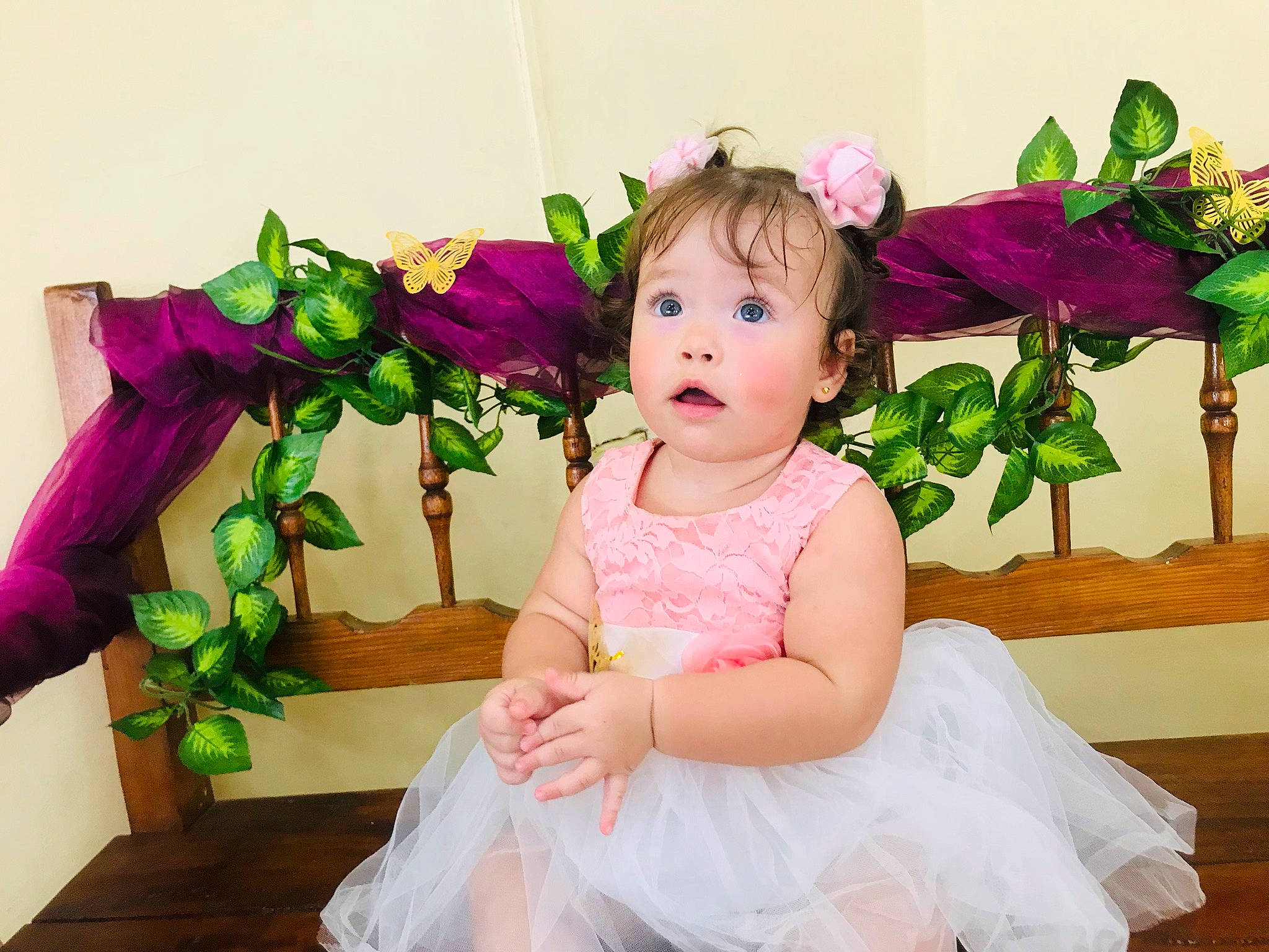 Allison is registered to the contest to win money with this photo: baby, baby_toddler_clothing, child, cut_flowers, flash_photography, flower, flower_arranging, fun, happy, headgear, headpiece, iris, magenta, person, petal, pink, plant, purple, surprise, textile