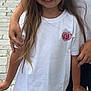Jade participe au concours pour gagner de l'argent avec cette photo : child, girl, smiling, flower_crown, white_tshirt, bandage, knee, street, cobblestone, hand, person, happy, standing, casual_clothing, summer, outdoor, footwear, sneakers, long_hair, portrait