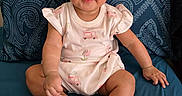 Sofia joined the competition — help win amazing prizes! baby, child, infant, onesie, blue_bed, pillow, pattern, smile, face, hands, feet, sitting, cute, indoors, portrait, skin, expression, bright_eyes, clothing, person