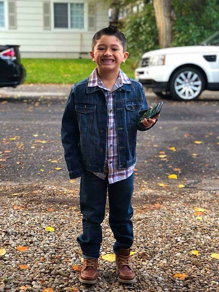 Elijah is registered to the contest to win money with this photo: cool, denim, design, fun, jacket, jeans, joy, material, outerwear, pattern, person, plaid, recreation, road, standing, tartan, textile, tree, trousers