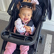 Ava participe au concours pour gagner de l'argent avec cette photo : baby, canopy, child, cup_holder, floral_shirt, happy, harness, parking_lot, pavement, pigtails, pink_pants, plush_toy, pram, seat, shoes, smile, sneakers, stroller, sunlight, toddler