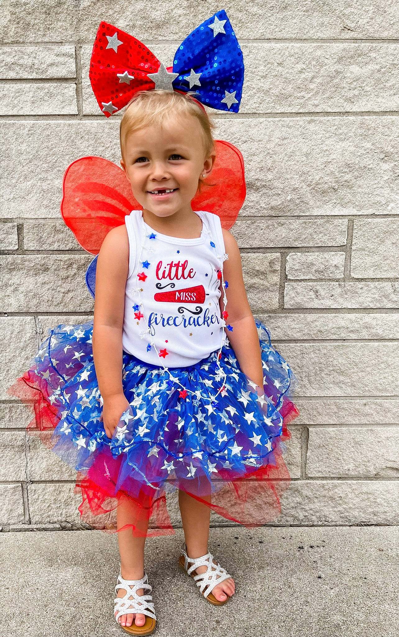 Remington is registered to the contest to win money with this photo: azure, baby_toddler_clothing, blue, child, clothing, electric_blue, event, fun, happy, headgear, joy, magenta, party_supply, pattern, person, photograph, pink, red, sleeve, smile