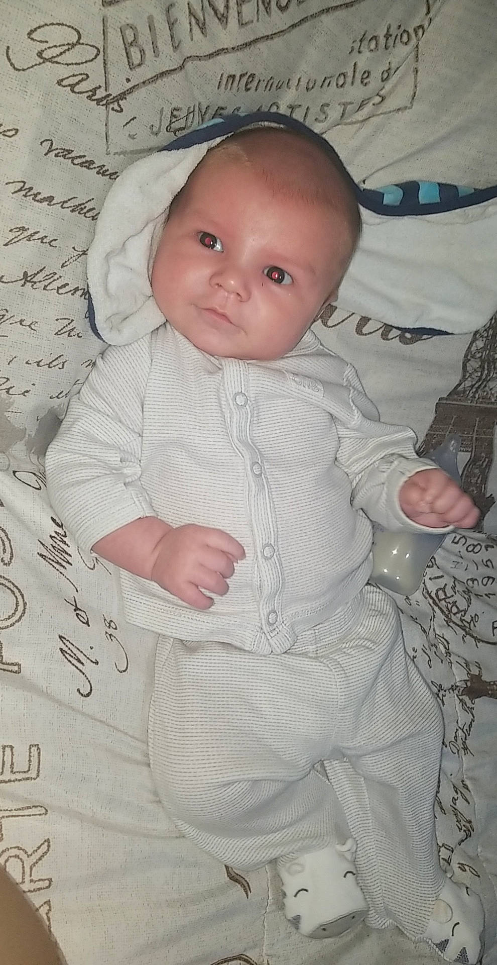 Cayde is registered to the contest to win money with this photo: baby, baby_products, baby_toddler_clothing, cheek, child, comfort, eye, happy, head, iris, linens, monochrome, pattern, person, portrait_photography, room, sitting, skin, sleeve, toddler