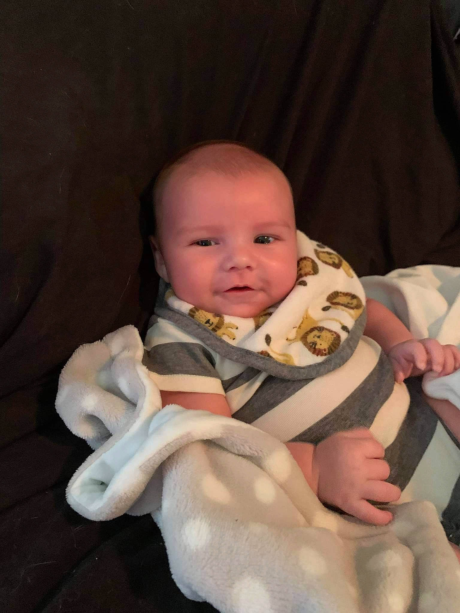 Cayde is registered to the contest to win money with this photo: abdomen, baby, baby_products, baby_toddler_clothing, cheek, comfort, eye, gesture, happy, head, human_body, iris, lap, nail, neck, person, skin, stomach, thumb, toddler