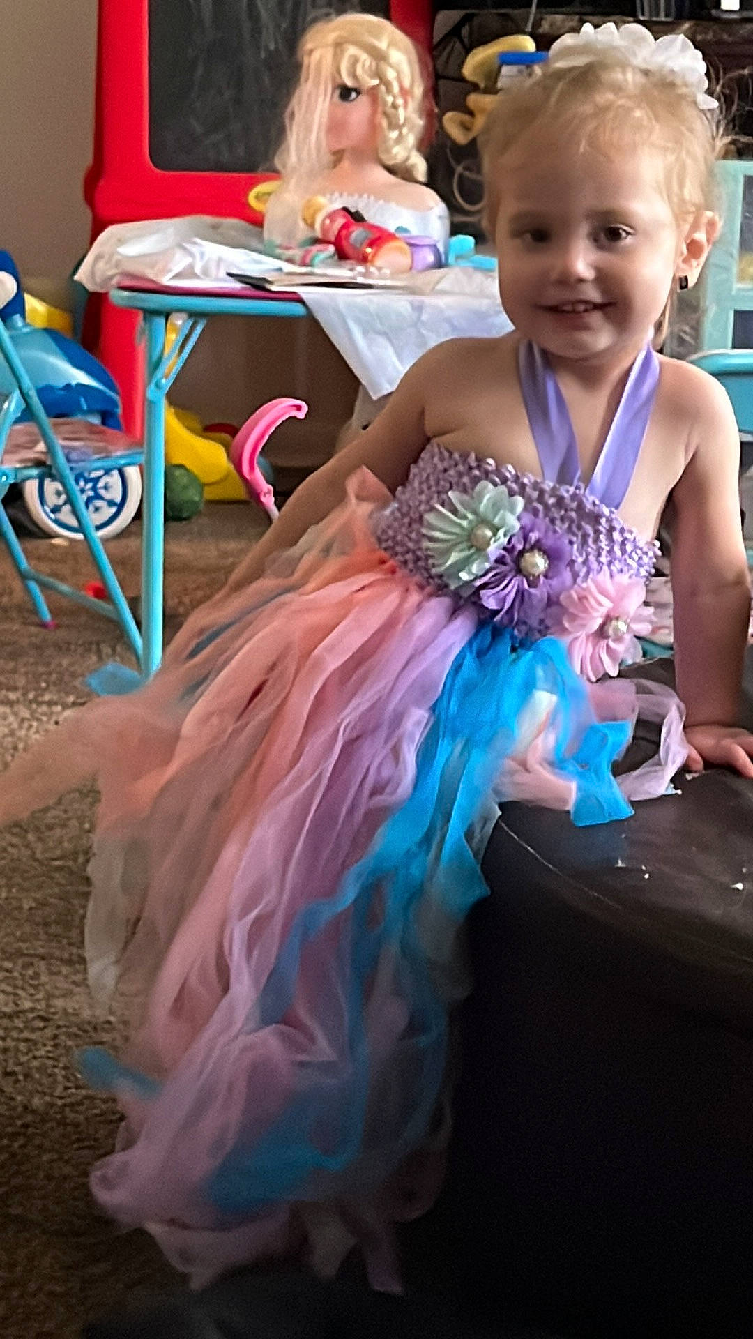 Shamaya joined the competition — help win amazing prizes! blue, chair, child, costume, electric_blue, entertainment, event, fashion_accessory, feather, fun, happy, headpiece, joy, magenta, party, party_supply, person, pink, purple, smile